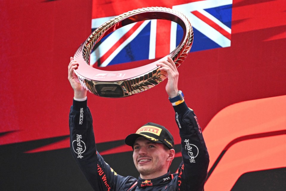 TOPSHOT - Red Bull Racing's Dutch driver Max Verstappen celebrates on the podium after winning the Formula One Chinese Grand Prix at the Shanghai International Circuit in Shanghai on April 21, 2024. (Photo by GREG BAKER / AFP) (Photo by GREG BAKER/AFP via Getty Images)