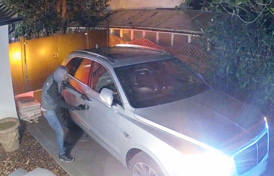 An accomplice then gains access to the car, parked nearby in a gated driveway