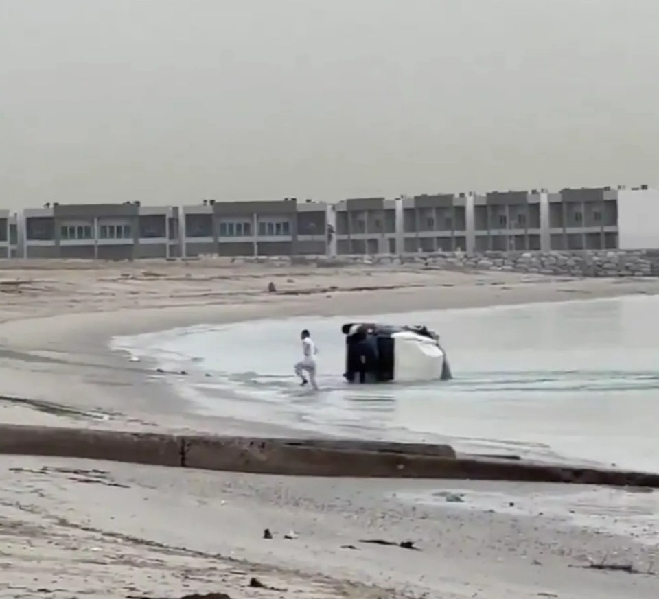 The 34-year-old immediately gets to his feet and walks off towards the sand