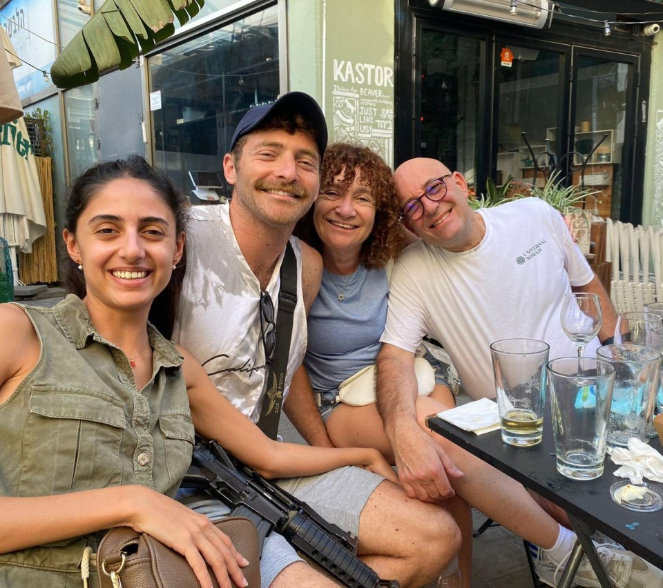 Sam with his fiance, mum and stepdad during a break from active duty