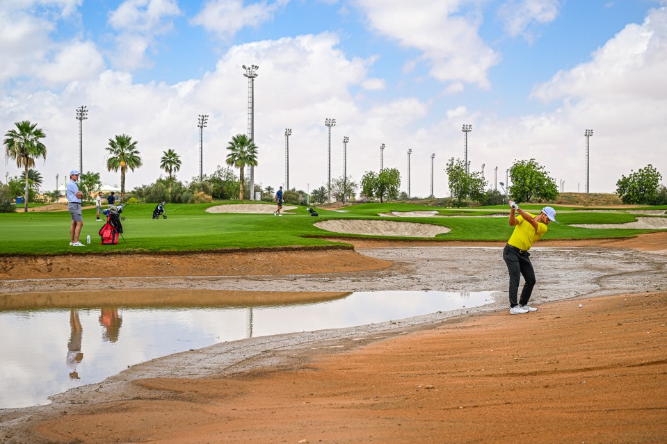 Spanish golfer Alejandro Canizares attempts to play a shot on the 12th hole in practice