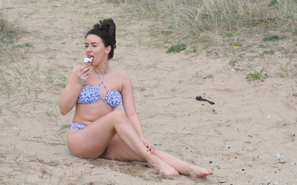 Ammie Shipton enjoys an ice cream on St Annes beach Lancashire