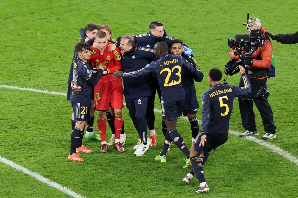 Lunin's colleagues and some Madrid staff raced over to congratulate him