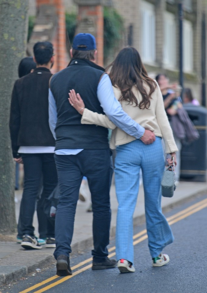 The duo looked extremely cosy as they strolled arm-in-arm through the streets of London