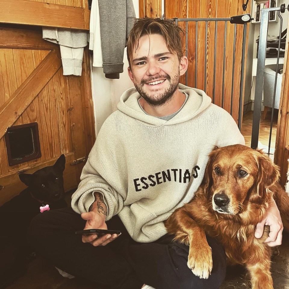 The 32-year-old pictured with his two dogs