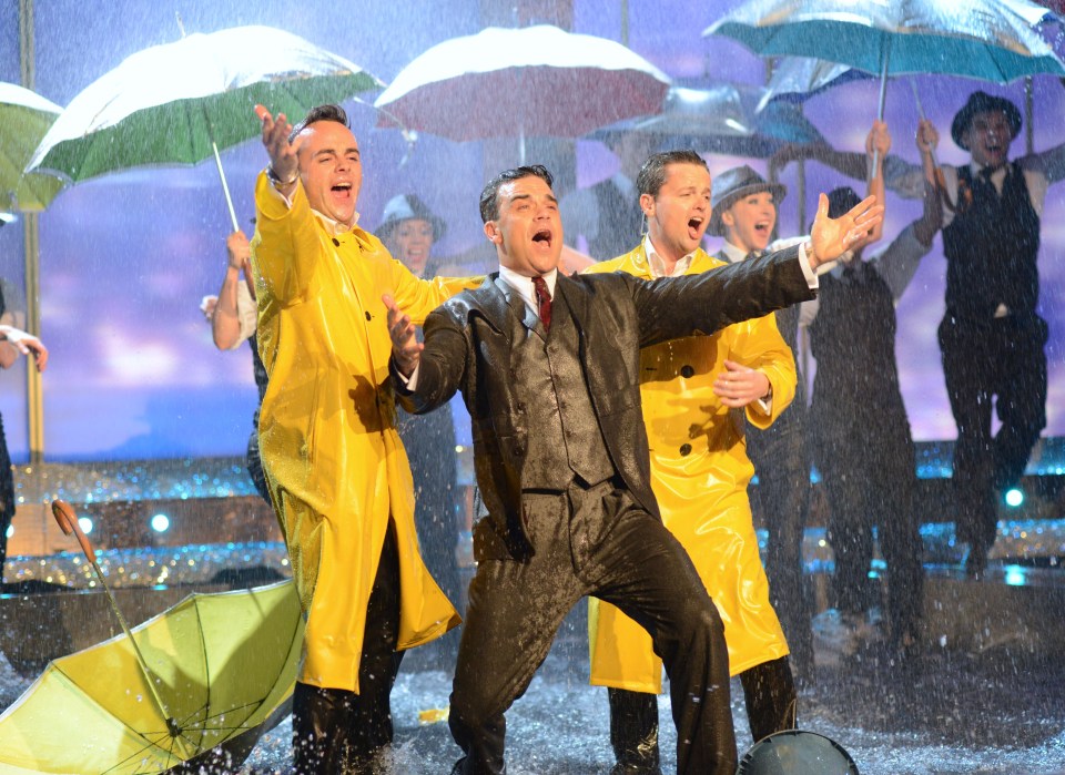 Ant and Dec soaked up the rain as they performed alongside Robbie Williams