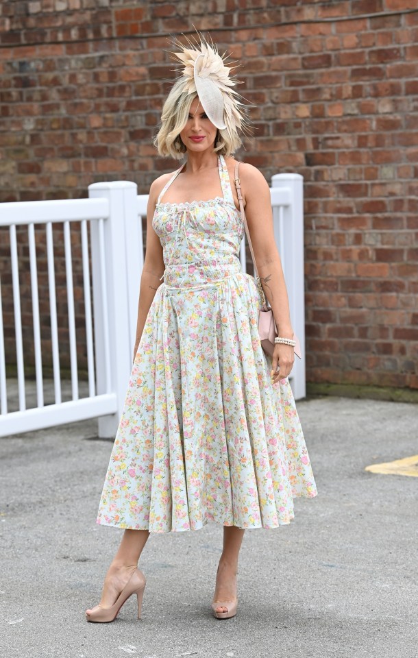 A pastel-hued ticket holder stood out from the crowd with her gorgeous floral strappy sun dress