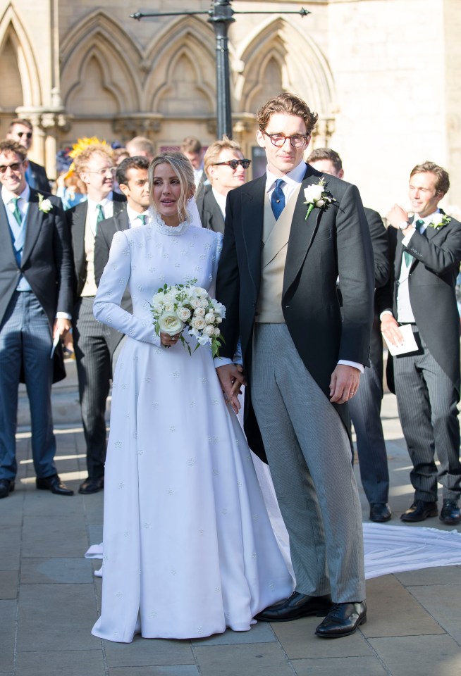 Ellie pictured with Caspar on their wedding day in 2019 with celebrity pals