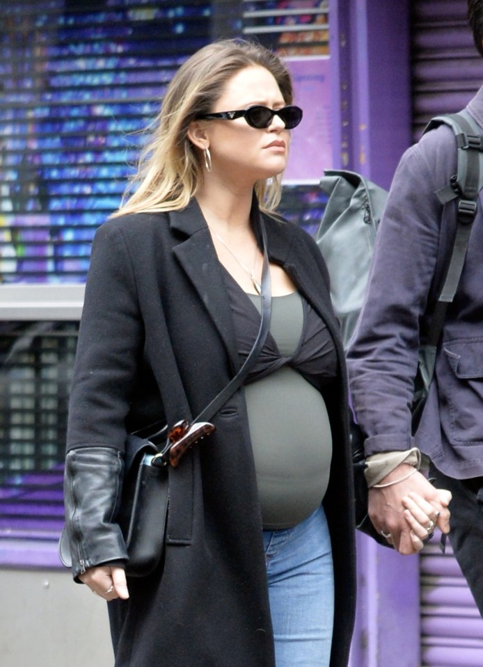 Pregnant Emily Atack was snapped showing off her baby bump