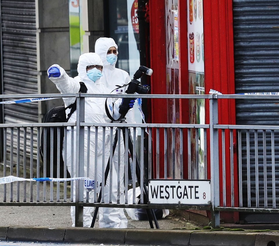 Forensic officers have been combing the street where the 27-year-old mum was killed