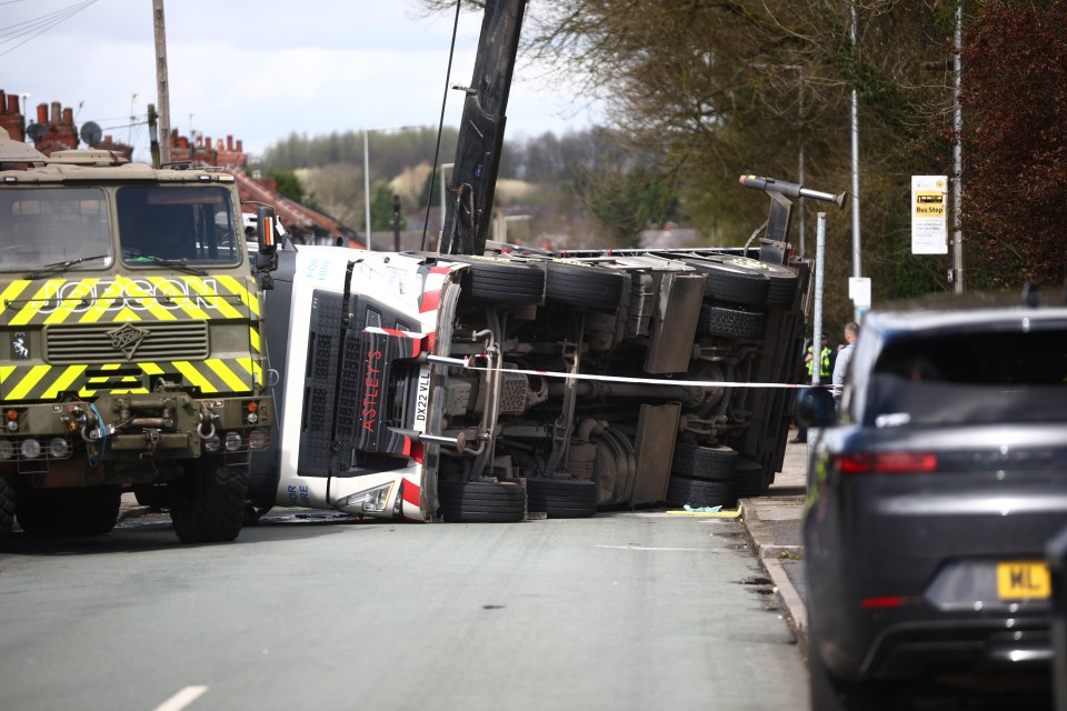 Storm Kathleen toppled a crane truck in Wigan near Manchester yesterday