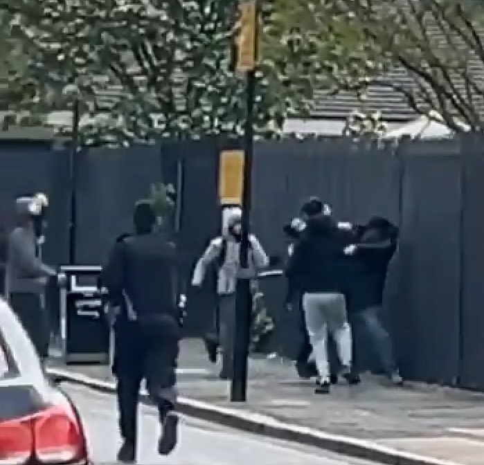 A brawl broke out between six masked people yesterday