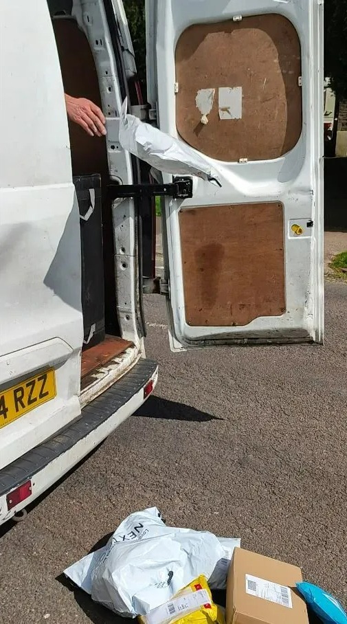 An Evri driver hurls parcels onto the street in Torquay, Devon, in shocking footage