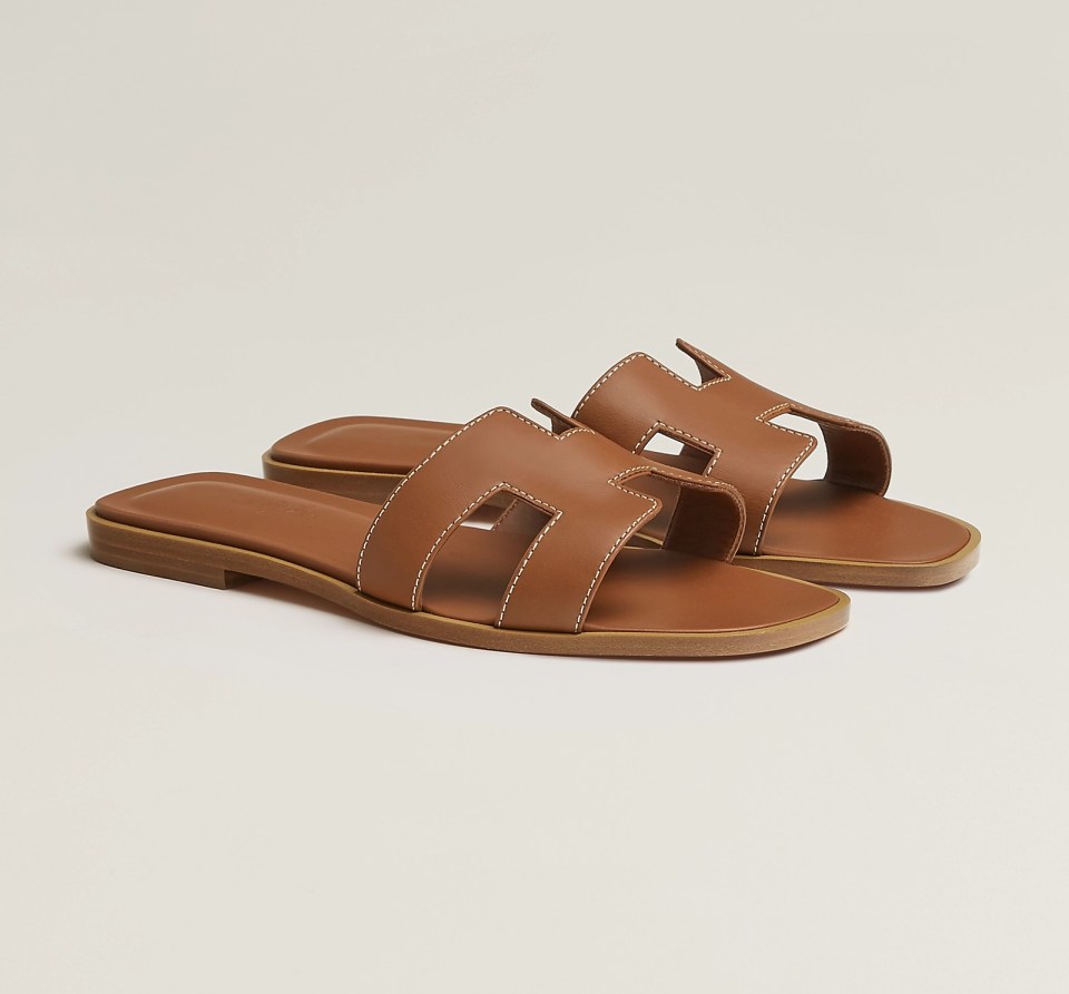 Hermès Oran Sandals in tan (pictured) are worn by influencers and celebs alike