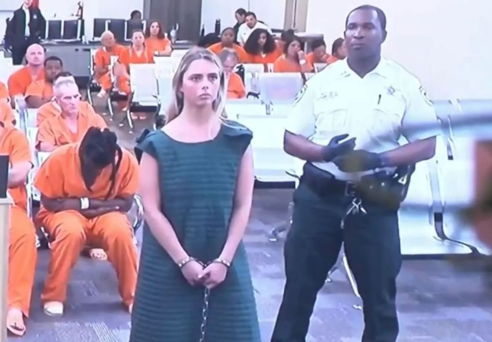 She was dragged to court as cops suspect she had at least five victims