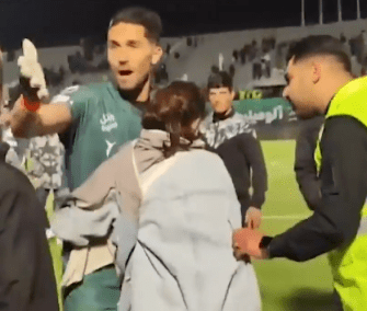 Goalkeeper Hossein Hosseini was banned after hugging this female fan