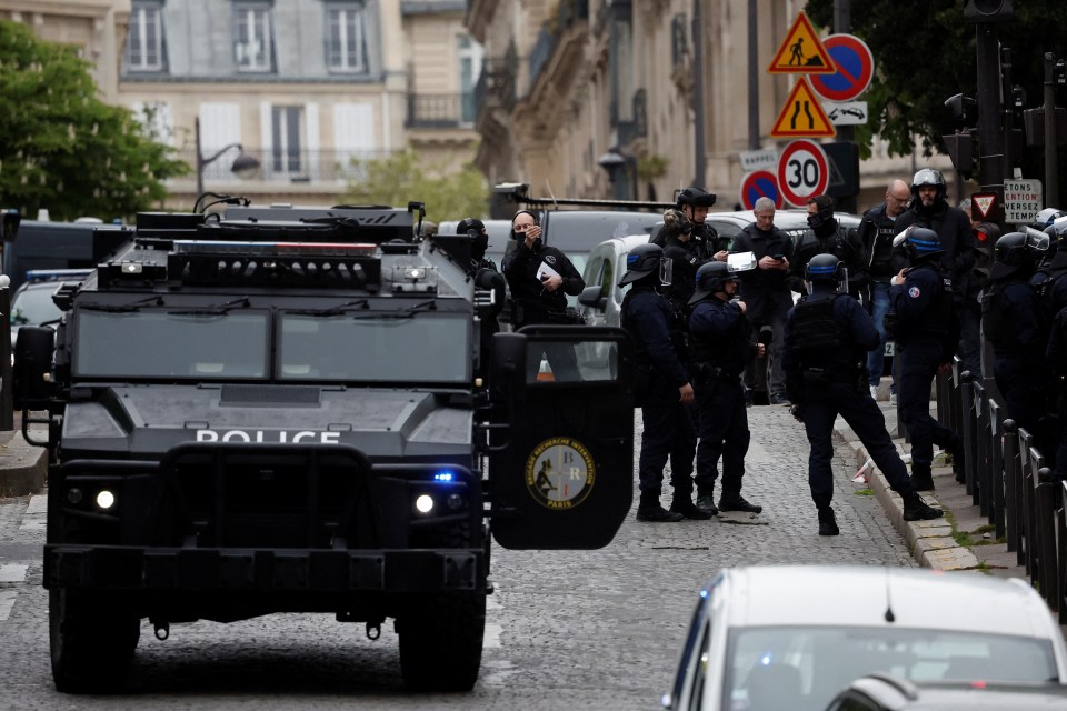 Armed police swarmed the Iranian consulate building this morning