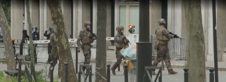 Other heavily-armed camouflaged French police forces were seen running