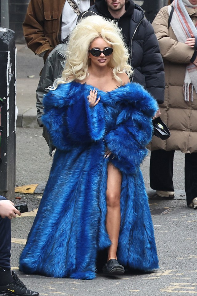 Jade Thirlwall looked unrecognisable in a blue faux fur coat and blonde beehive wig