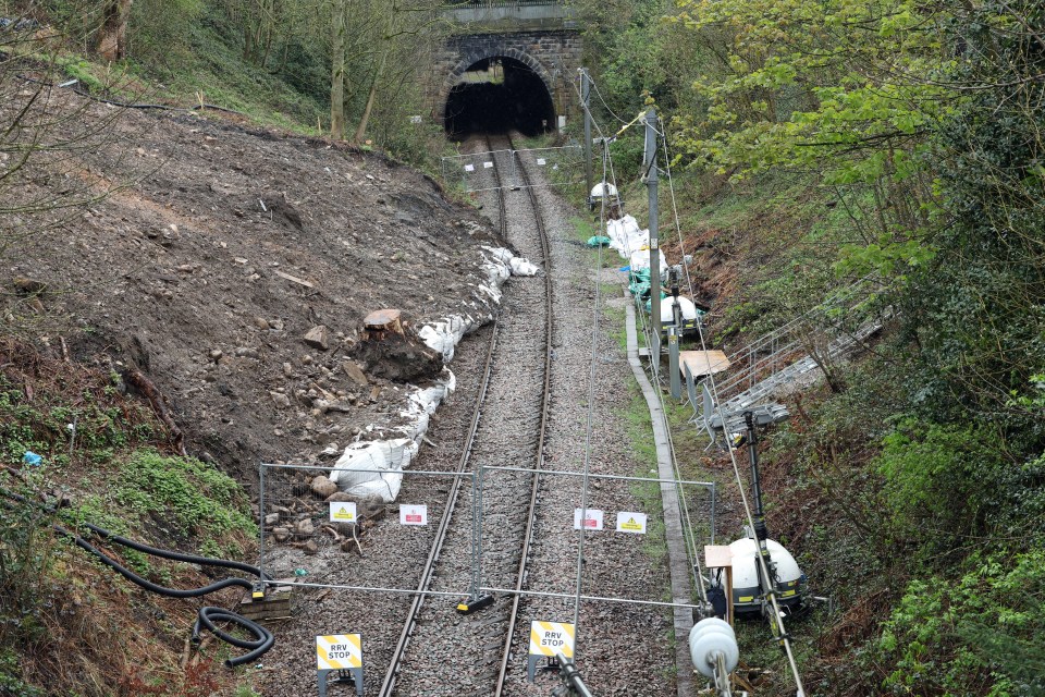 The Victorian railway embankment collapsed causing a landslide - with debris on the tracks