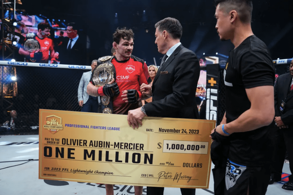 Olivier Aubin-Mercier with his $1m cash prize and title belt