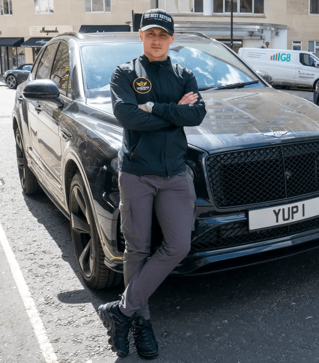 Alfie Best Jnr posing in front of his Bentley