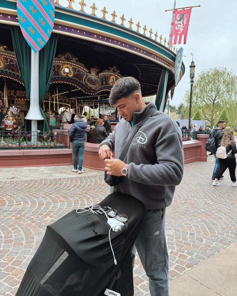 a man wearing a jacket that says disney on it