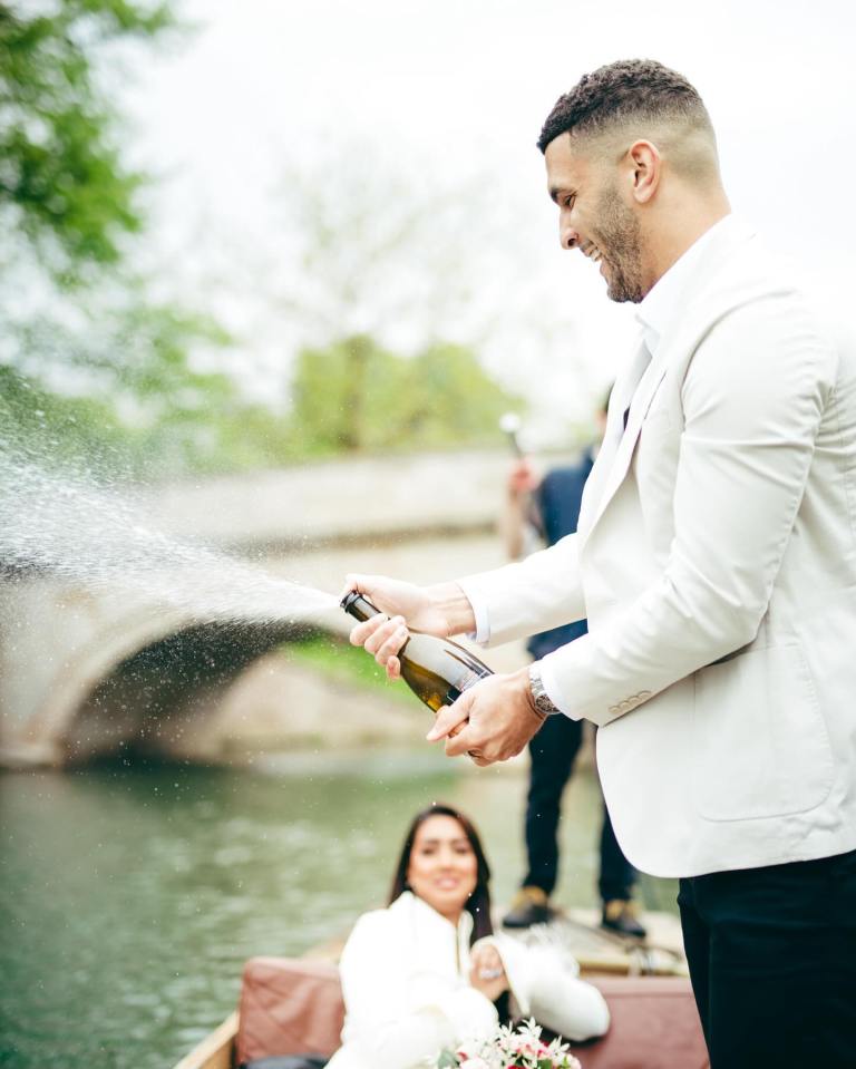 Kai popped a bottle of bubbly to celebrate