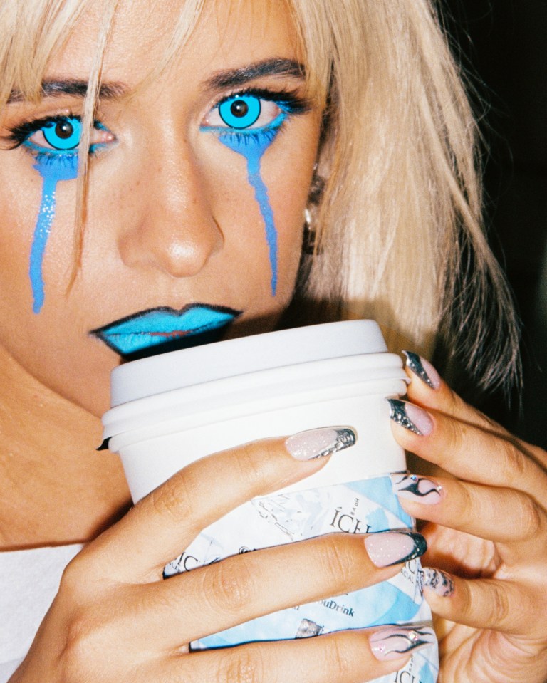 The singer also appeared to cry blue tears as she sipped a warm drink