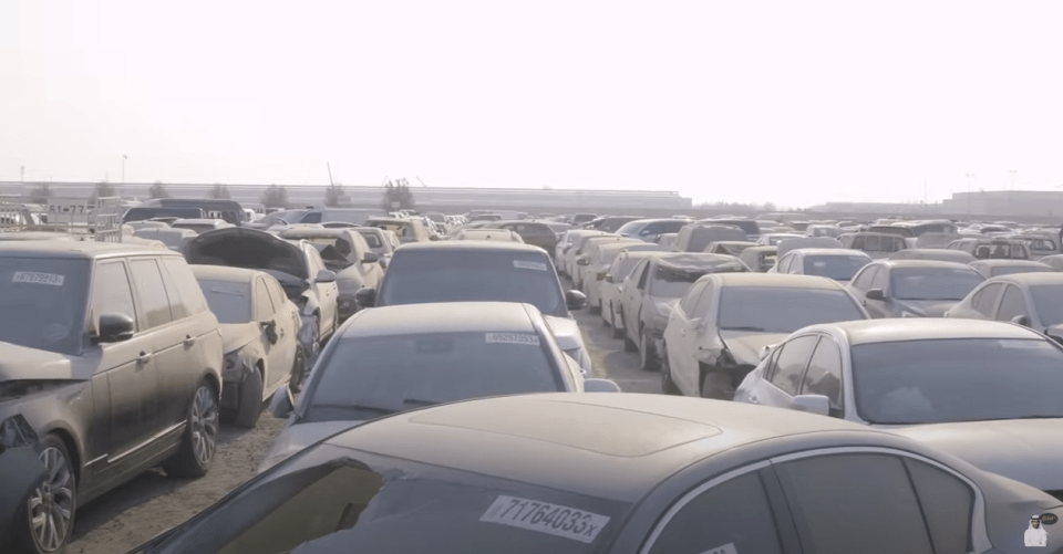 Thousands of cars were lined up in rows gathering dust in the Dubai heat