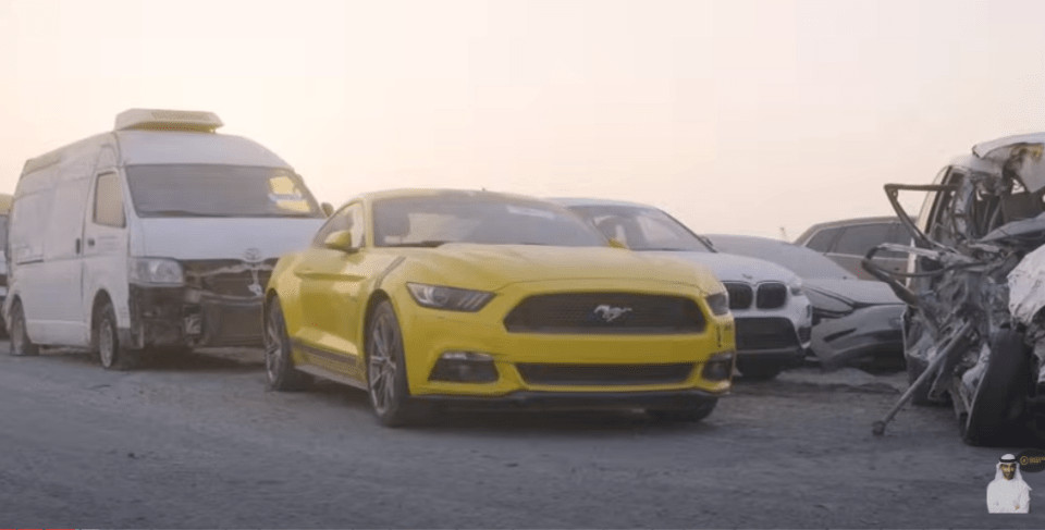 A bright yellow Mustang with shiny paint was also up for grabs