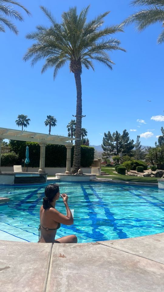 The Love Island anchor posed by a pool before the festival antics began