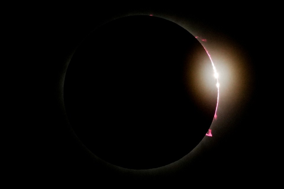 The moon partially covers the sun during a total solar eclipse in Mazatlan, Mexico