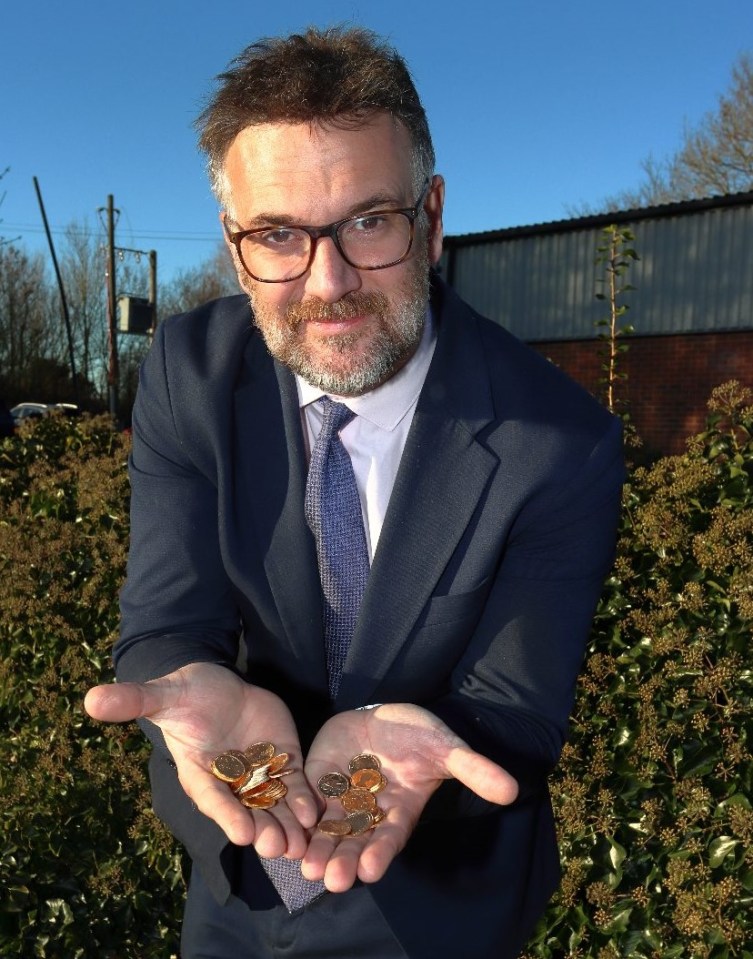 Hanson with some of the gold coins found in a linen box