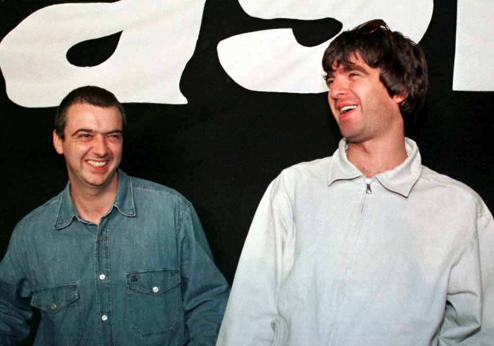 Noel Gallagher (R) and Paul McGuigan from the British rock band Oasis