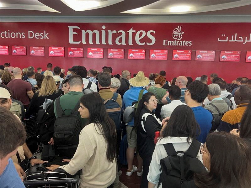 Passengers wait for their flights at the Dubai International Airport on Wednesday