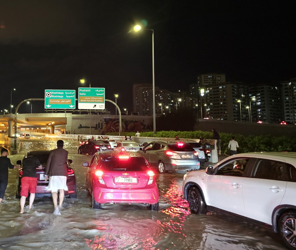 Cars are forced to a standstill on flooded roads