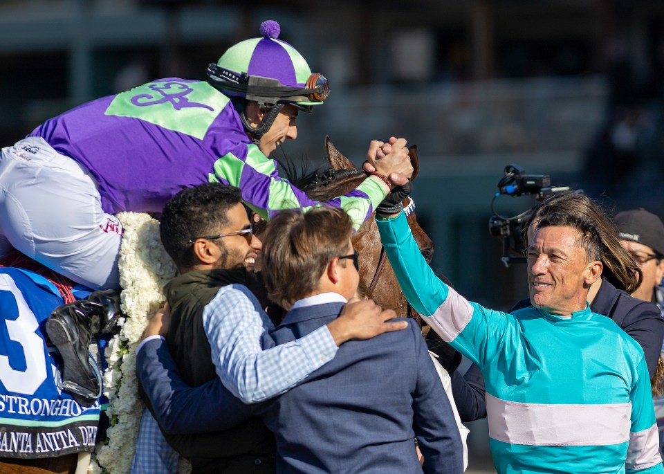 Dettori celebrates with jockey Antonio Fresu