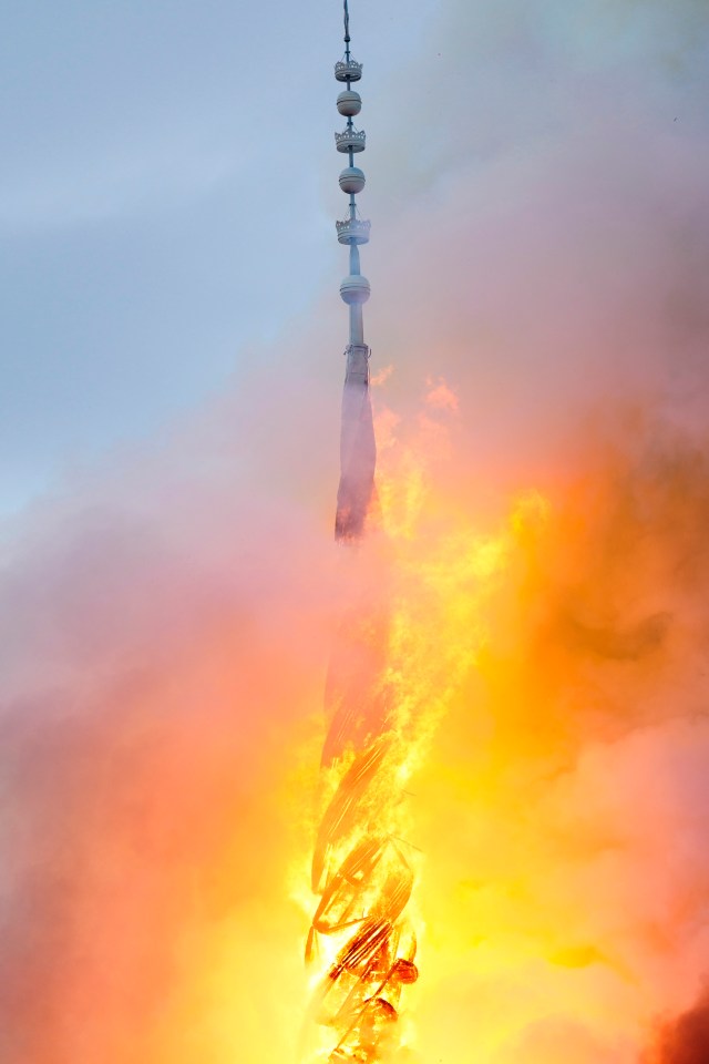 Copenhagen's old Stock Exchange's 184ft spire was incinerated by the fire this morning and collapsed onto the roof