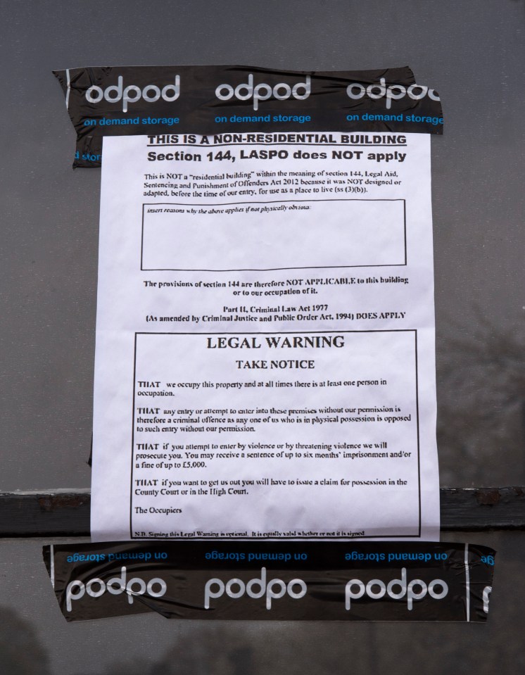 The brazen legal notice on the door from ‘the occupiers’ warns they can stay put