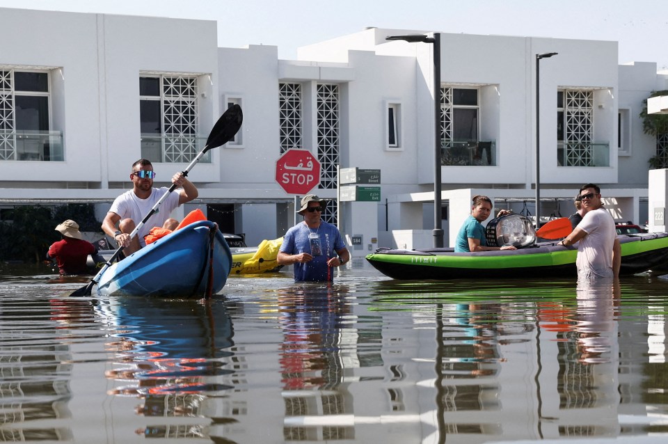 Residents were forced to get around using boats as cars have been abandoned on the streets