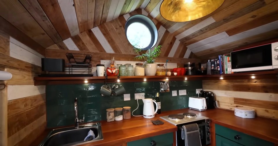 The tiny home has a fully decked out kitchen