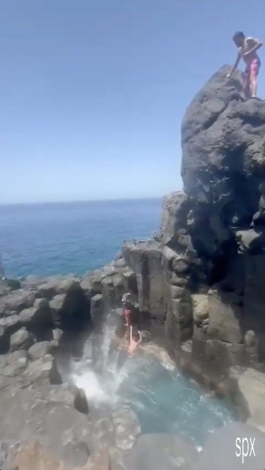 He landed feet-first on rocks before falling into the water