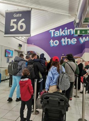 The traveller explained that major delays through security clearance caused a backlog of people waiting to get through