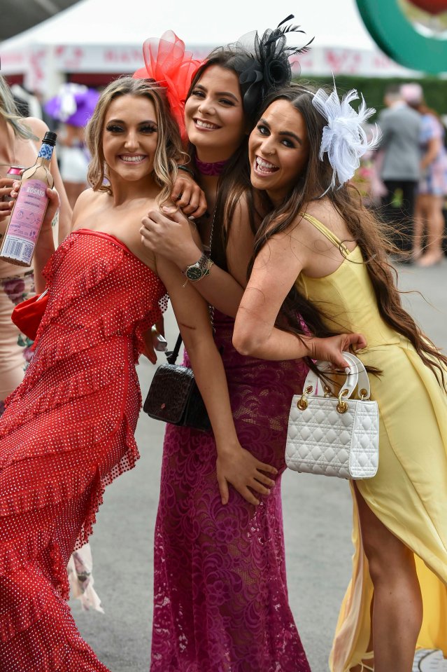 Stylish friends beamed as they enjoyed their day at the racing extravaganza