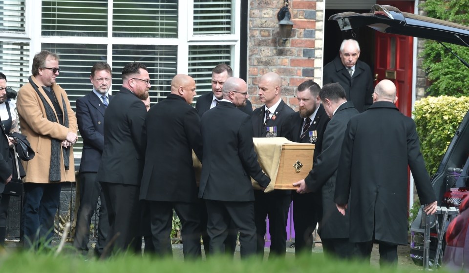 Pallbearers could seen removing Paul's coffin from his home before placing it into the back of a waiting hearse