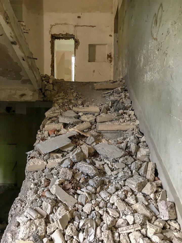 What used to be a stairwell is now a pile of debris