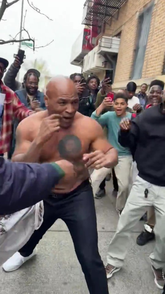 Tyson ripped off his shirt in front of an excited up crowd on the street