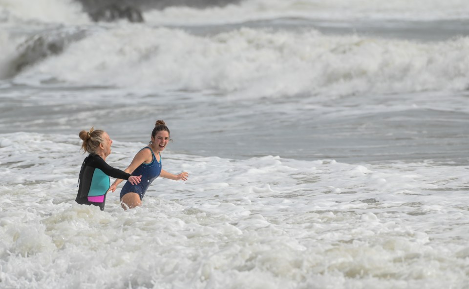 Two swimmers brave the water in Swansea