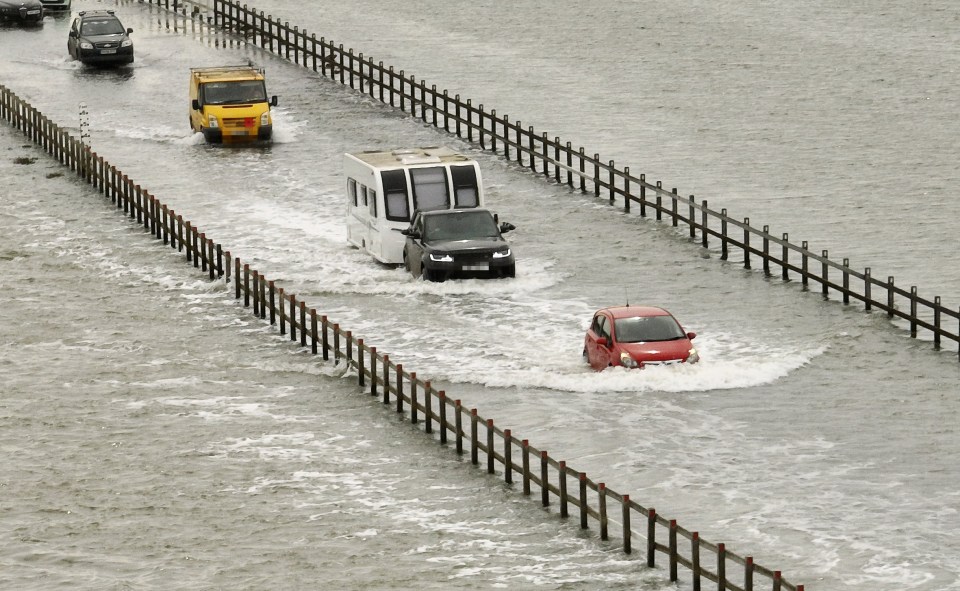 A number of cars got stranded during high tide at the Strood, near Colchester, Essex